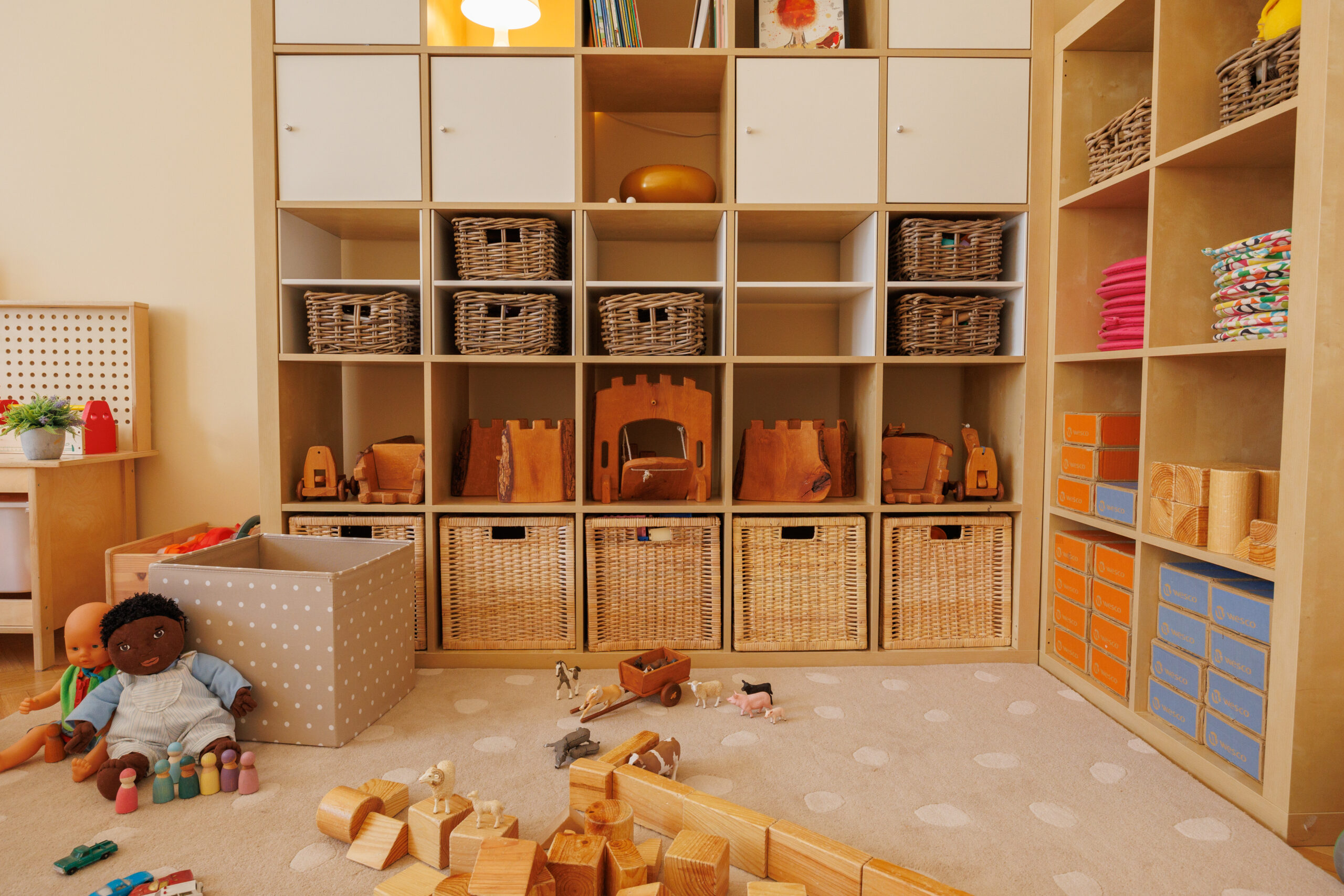 Building and construction learning corner in a kindergarten classroom, arranged as part of a True Toys enhancement project with meaningful organization of toys on shelves